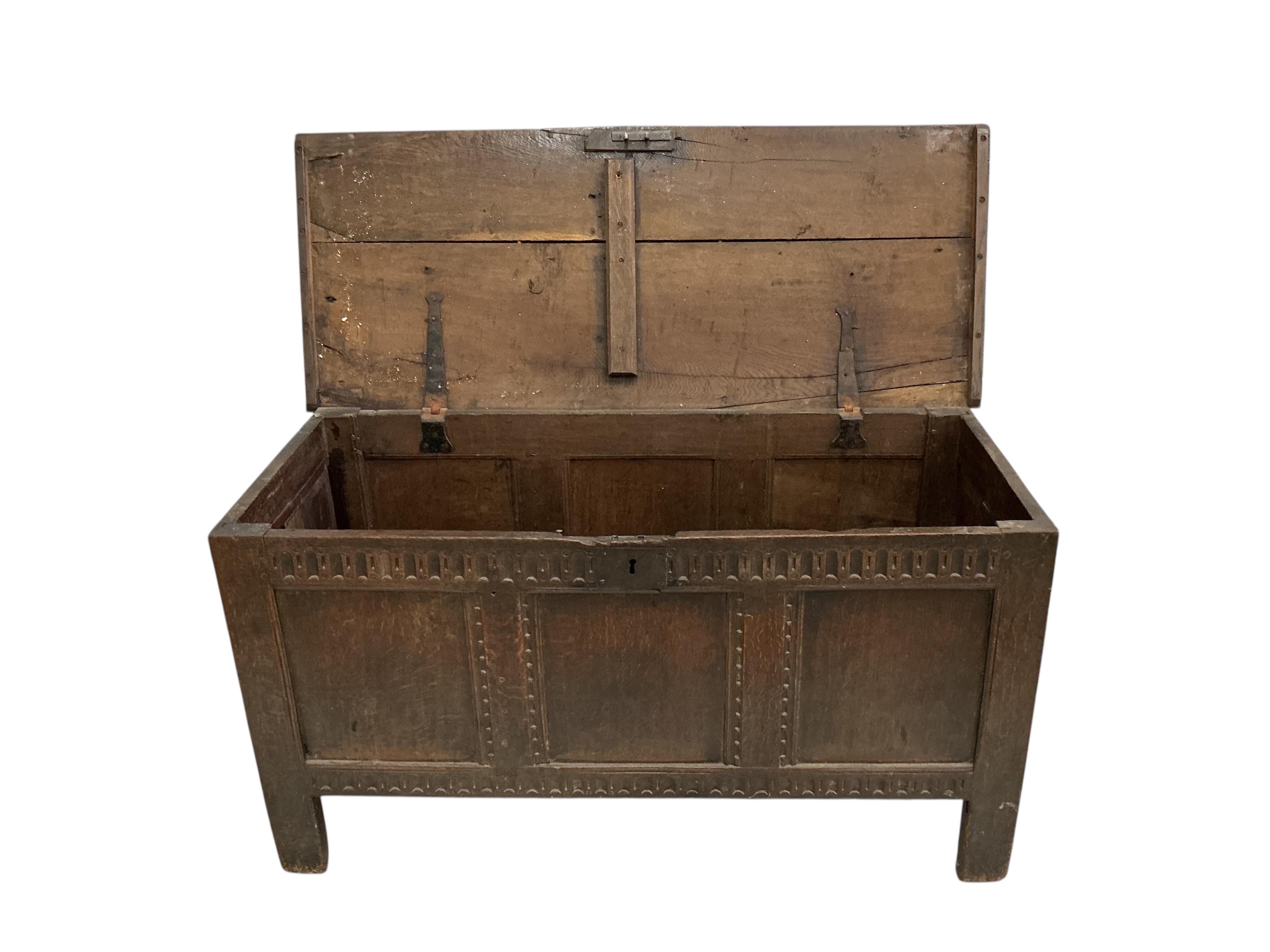 An 18th century oak coffer, width 122cm, depth 49cm, height 63cm